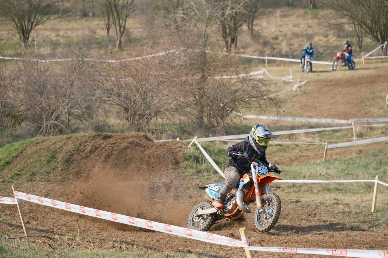 About Dynamic motocross action captured in Jihomoravský kraj, showcasing riders navigating a dirt track.